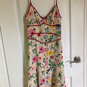 Sandra Angelozzi floral silk summer dress with red spaguetti straps.